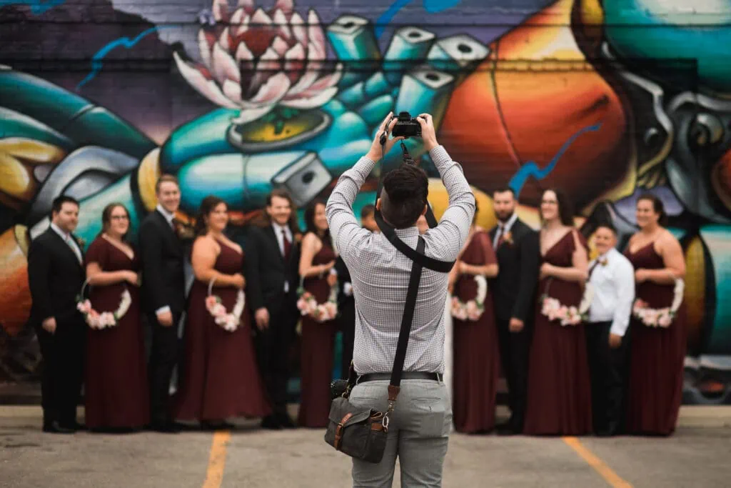 ben lariviere photographing a wedding party in downtown kitchener